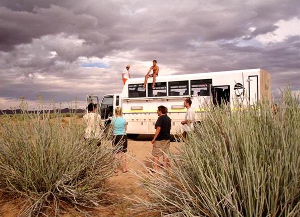 Clouds darken the sky as overlanders stop for a breather.